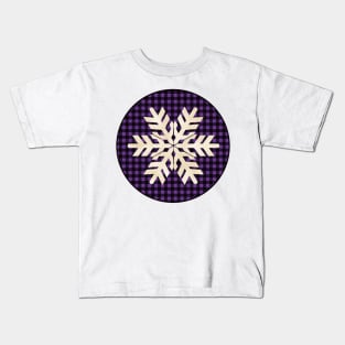 Snowflake silhouette over a black and violet tile pattern Kids T-Shirt